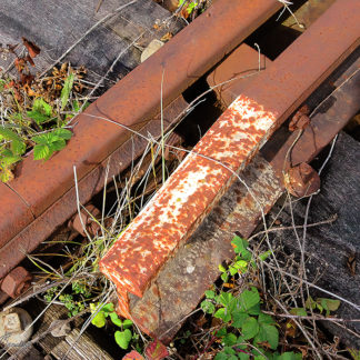 Aiguillage de rail SNCF possédant les stigmates du temps et de l'usage.